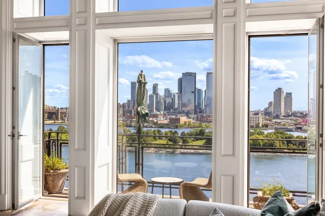 a living room with furniture and large window