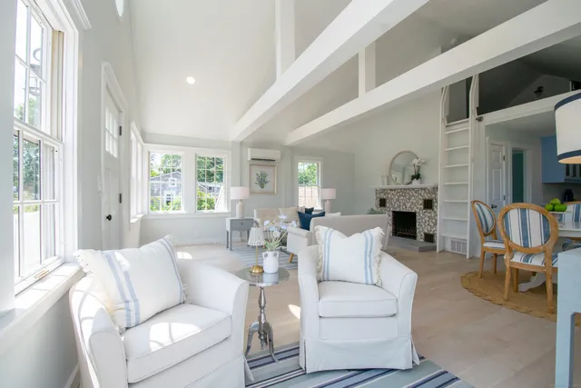 a living room with furniture or couch and a wooden floor