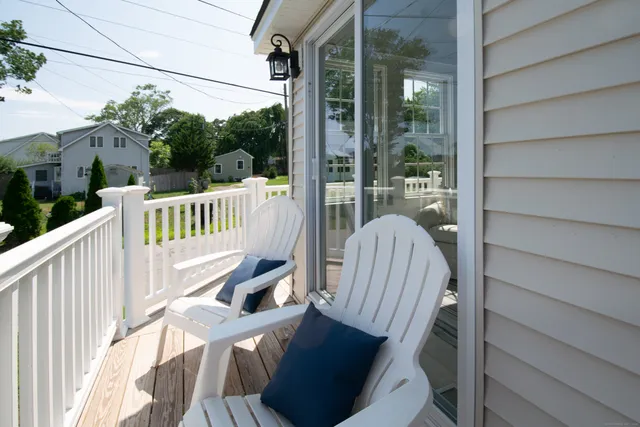 a view of balcony with wooden floor
