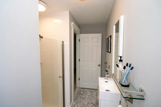 a bathroom with a sink and a mirror