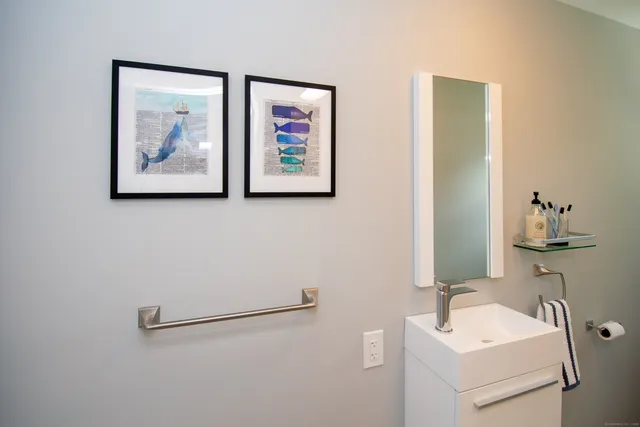 a spacious bedroom with a bed and a large window