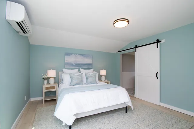 a bath tub sitting in a bathroom next to a window
