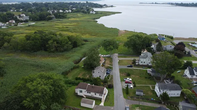 an aerial view of house with yard swimming pool and outdoor seating