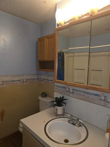 a house that has a tree in front of it