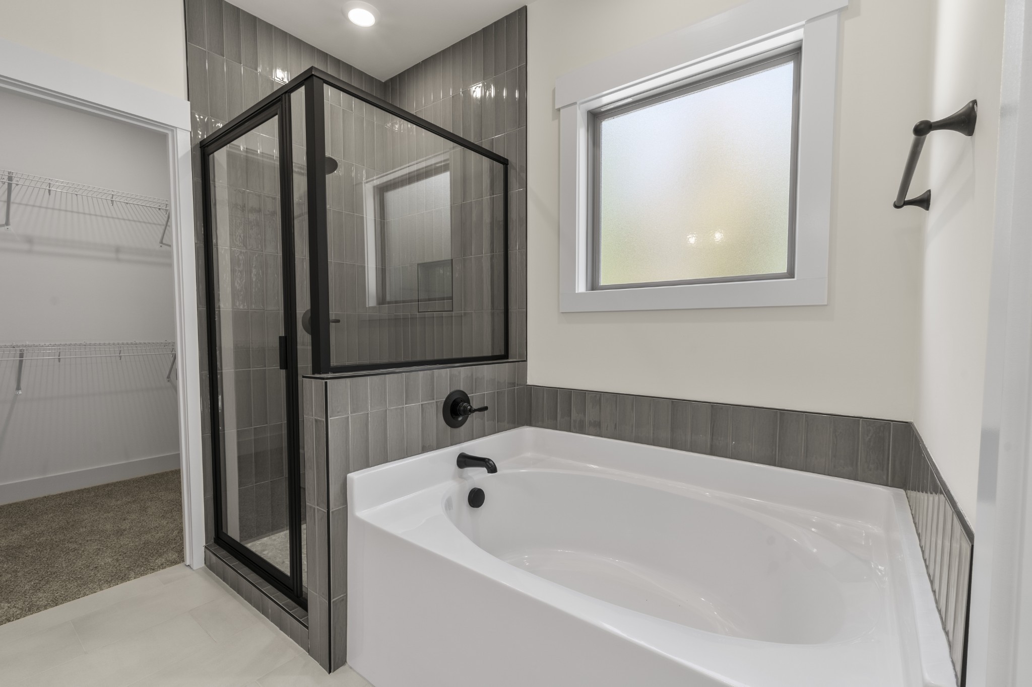 2969 Lights Chapel Road Greenbrier, TN 37073 - Photo 18 of 34 a bathroom with a bathtub and a shower