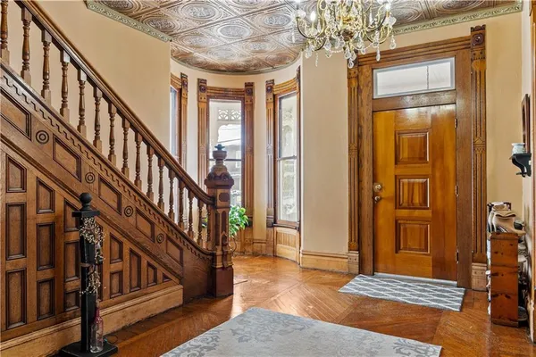 a view of entryway with wooden floor
