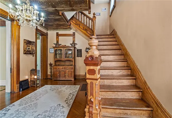 a view of front door with wooden floor