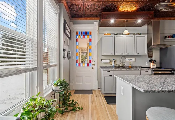 a kitchen with stainless steel appliances granite countertop a stove and a sink
