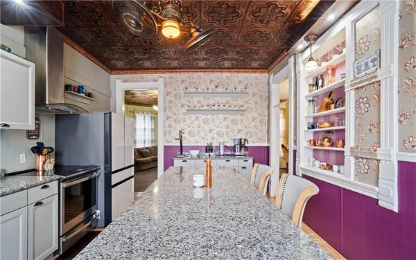 a kitchen that has a lot of cabinets in it