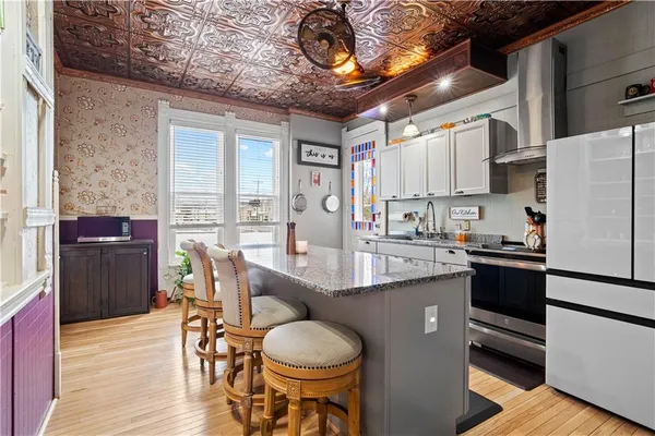 a bathroom with a bathtub sink and mirror