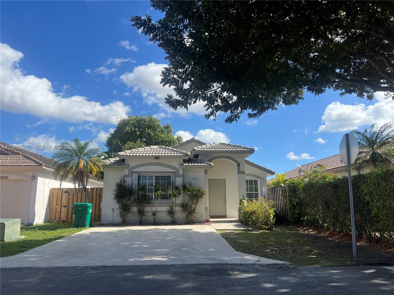 14225 Southwest 149th Avenue, Unit 14225 Miami, FL 33196 - Photo 1 of 19 a view of a house with a yard