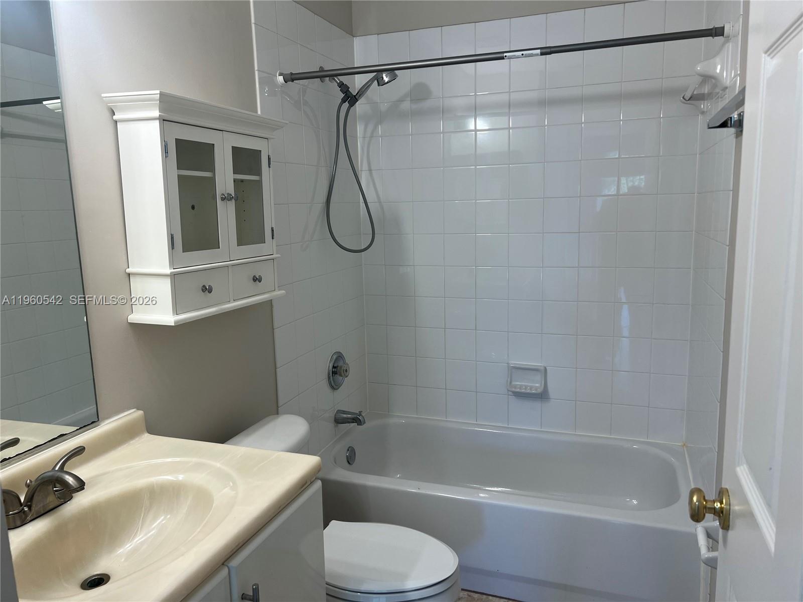 14225 Southwest 149th Avenue, Unit 14225 Miami, FL 33196 - Photo 11 of 19 a bathroom with a sink toilet and shower