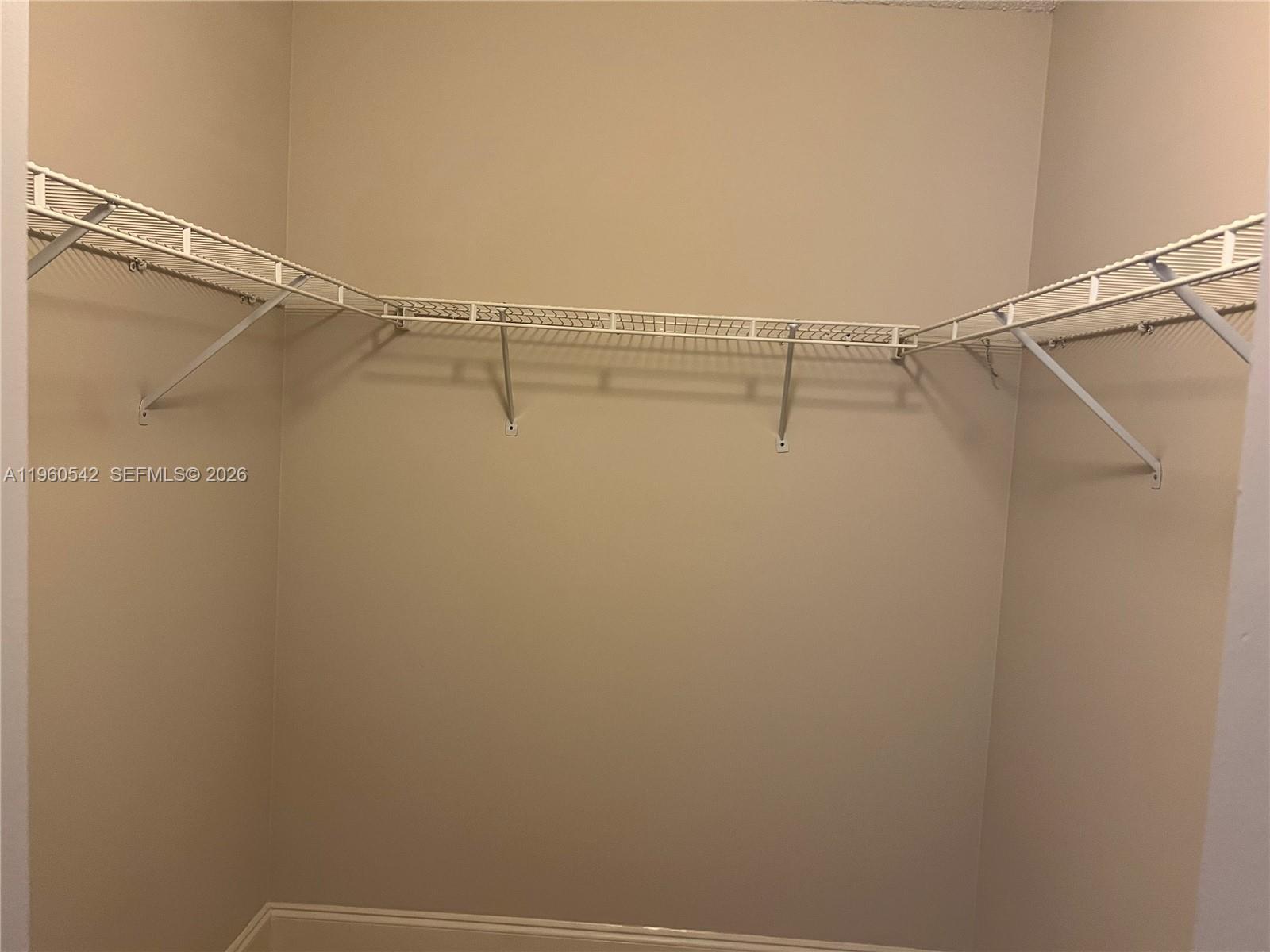 14225 Southwest 149th Avenue, Unit 14225 Miami, FL 33196 - Photo 13 of 19 a view of a room with racks on the wall