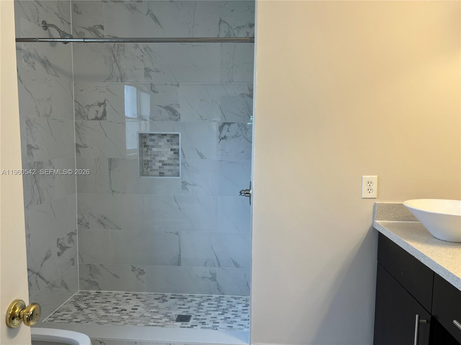 14225 Southwest 149th Avenue, Unit 14225 Miami, FL 33196 - Photo 15 of 19 a bathroom with a sink shower and a mirror
