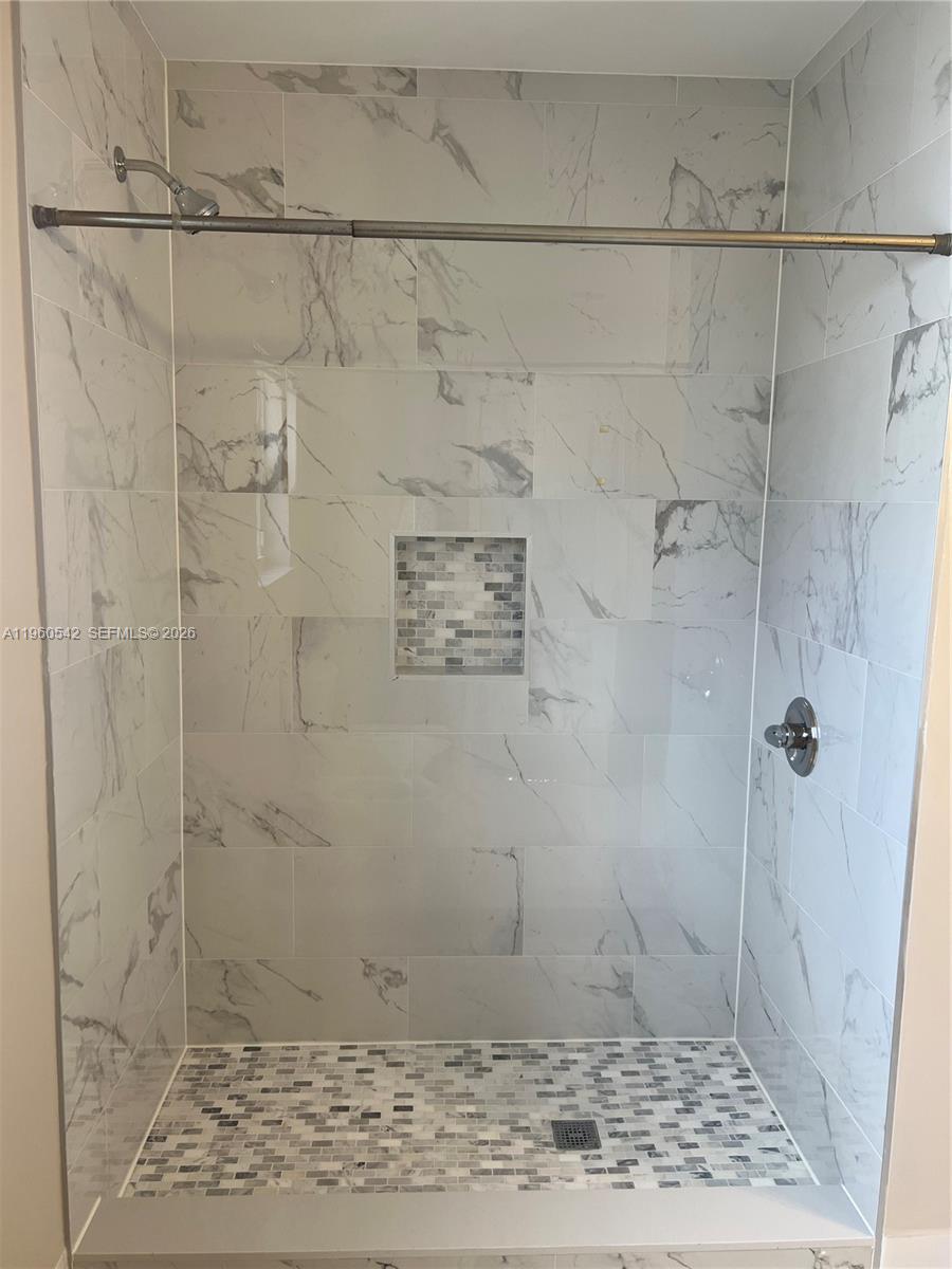 14225 Southwest 149th Avenue, Unit 14225 Miami, FL 33196 - Photo 16 of 19 a bathroom with a shower