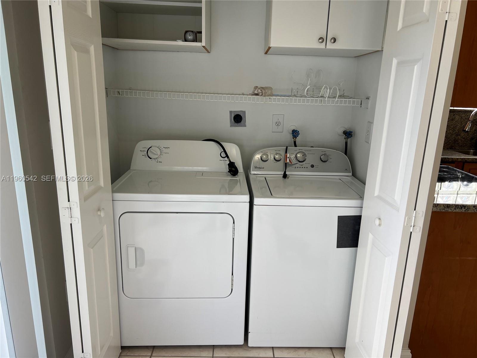 14225 Southwest 149th Avenue, Unit 14225 Miami, FL 33196 - Photo 8 of 19 a utility room with dryer and washer