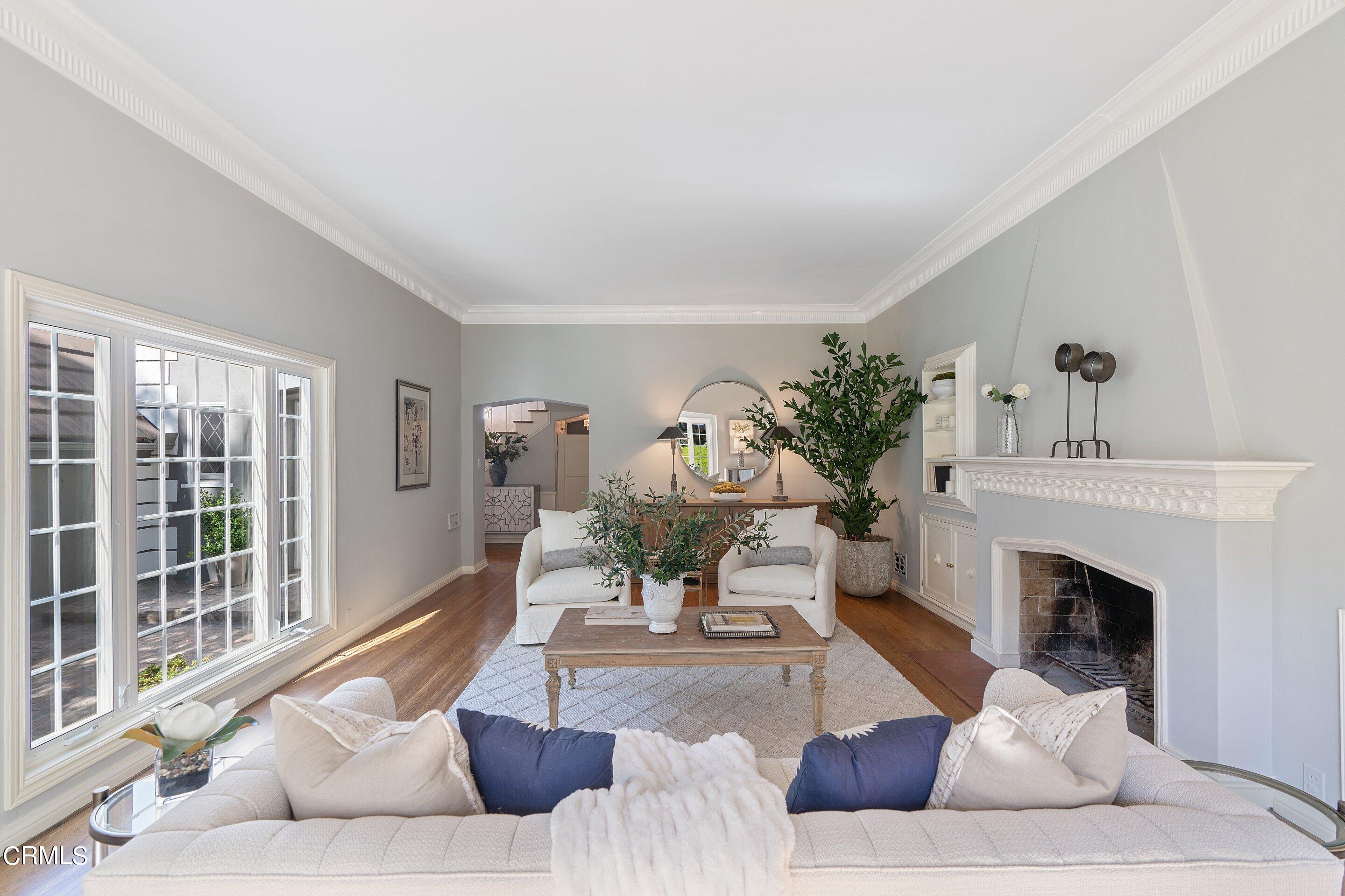 1637 Valley View Road Glendale, CA 91202 - Photo 12 of 66 a living room with furniture a fireplace and a potted plant