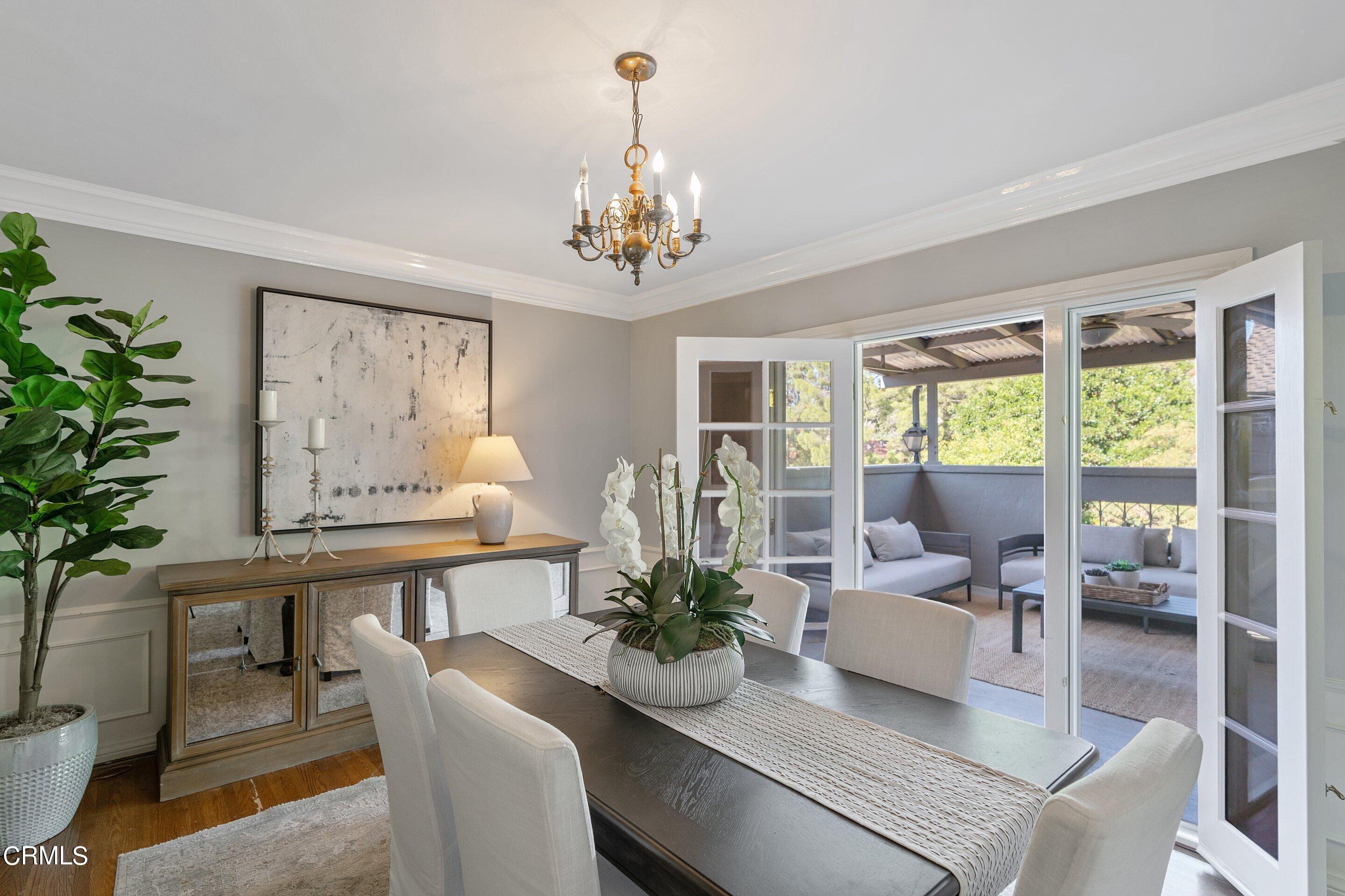 1637 Valley View Road Glendale, CA 91202 - Photo 16 of 66 a living room with furniture potted plant and a chandelier