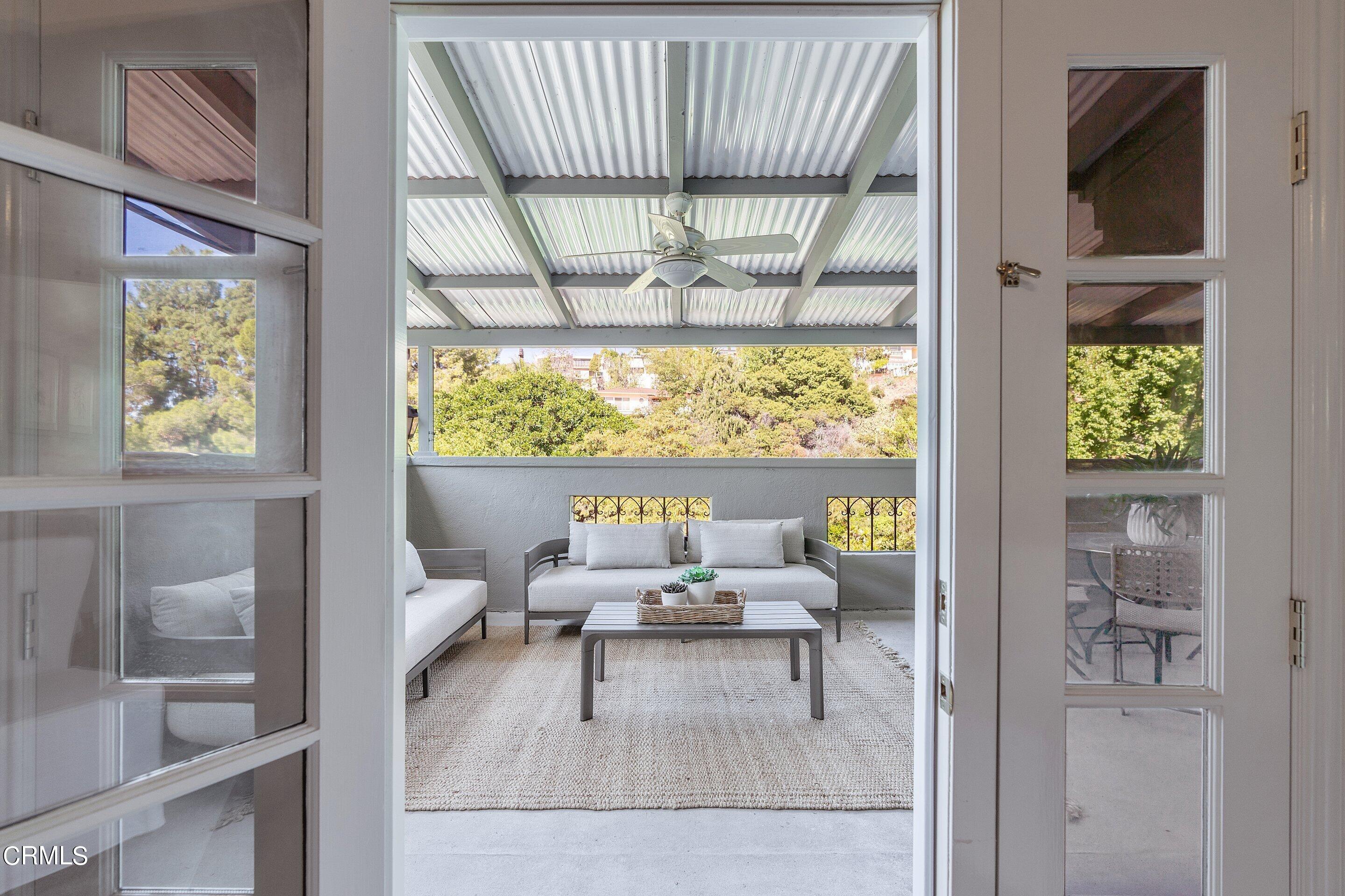 1637 Valley View Road Glendale, CA 91202 - Photo 21 of 66 a living room with furniture and a large window