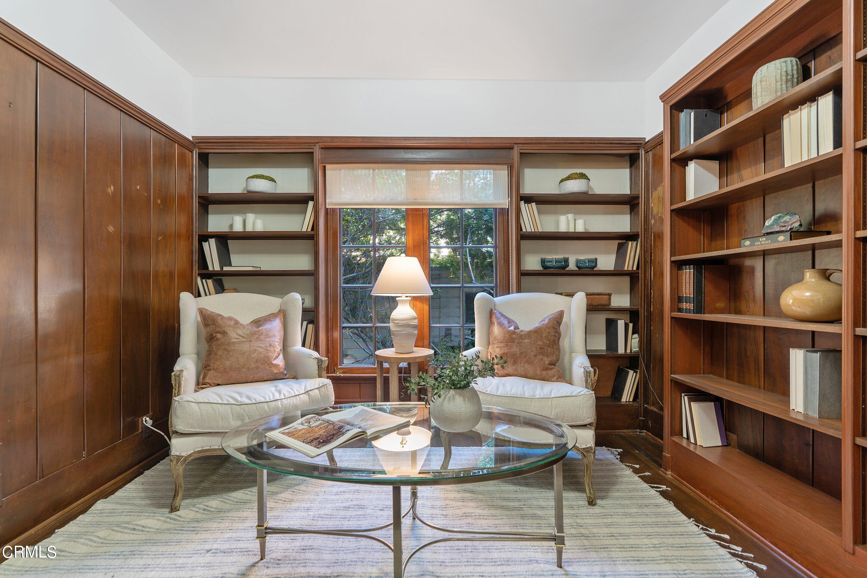1637 Valley View Road Glendale, CA 91202 - Photo 29 of 66 a living room with furniture a rug and a book shelf