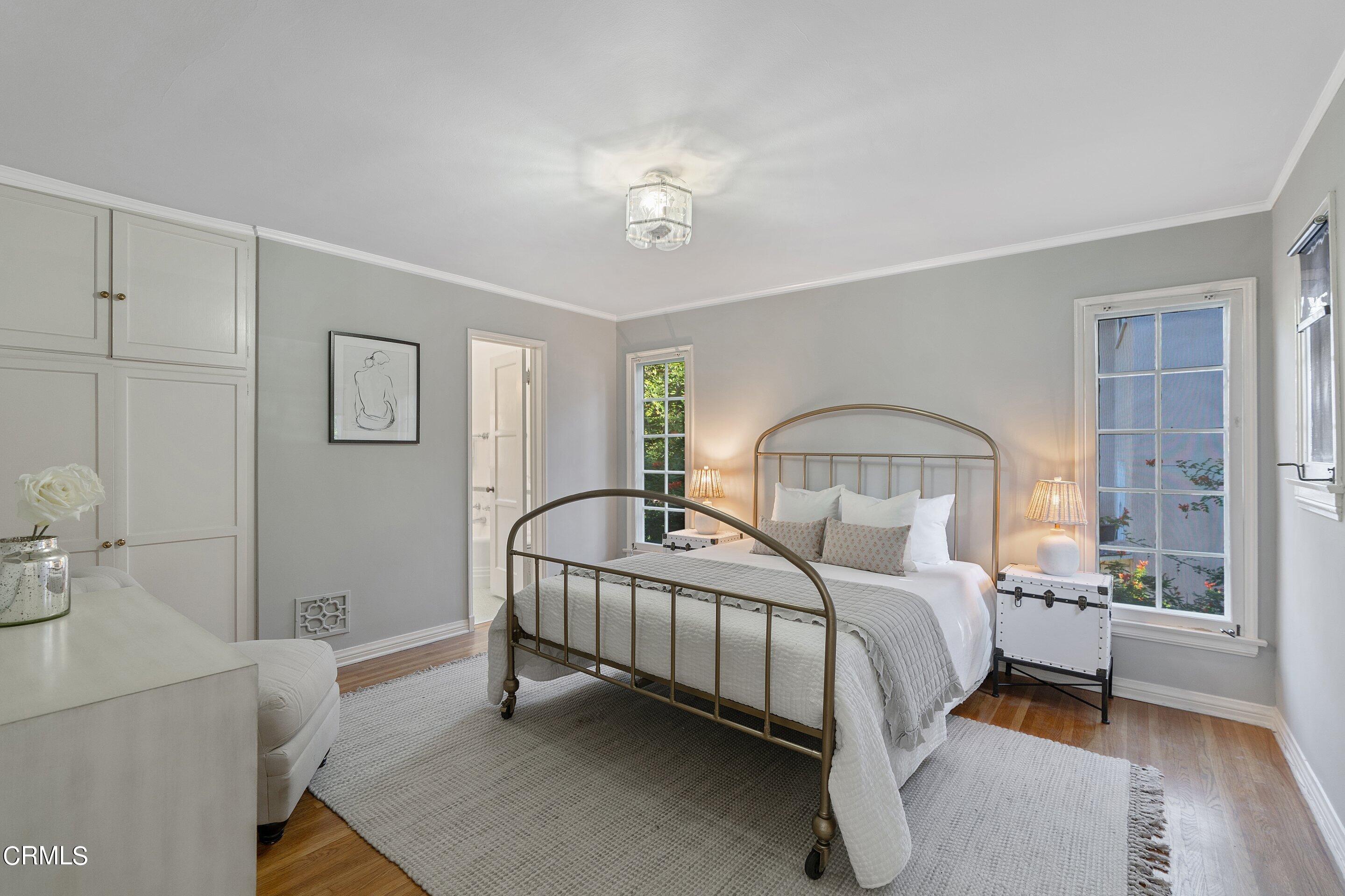 1637 Valley View Road Glendale, CA 91202 - Photo 30 of 66 a bedroom with a bed and a mirror