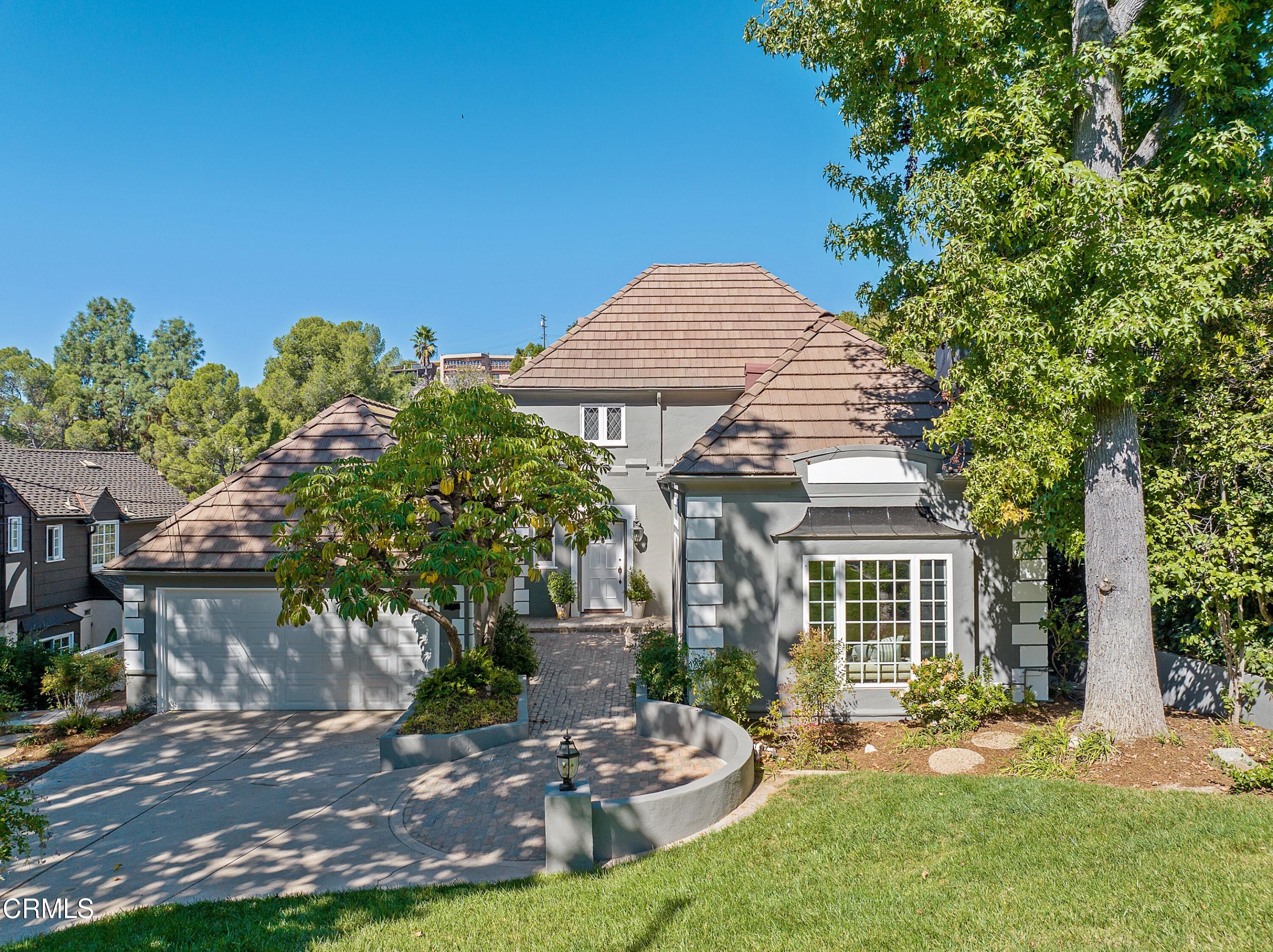1637 Valley View Road Glendale, CA 91202 - Photo 3 of 66 a front view of a house with a yard