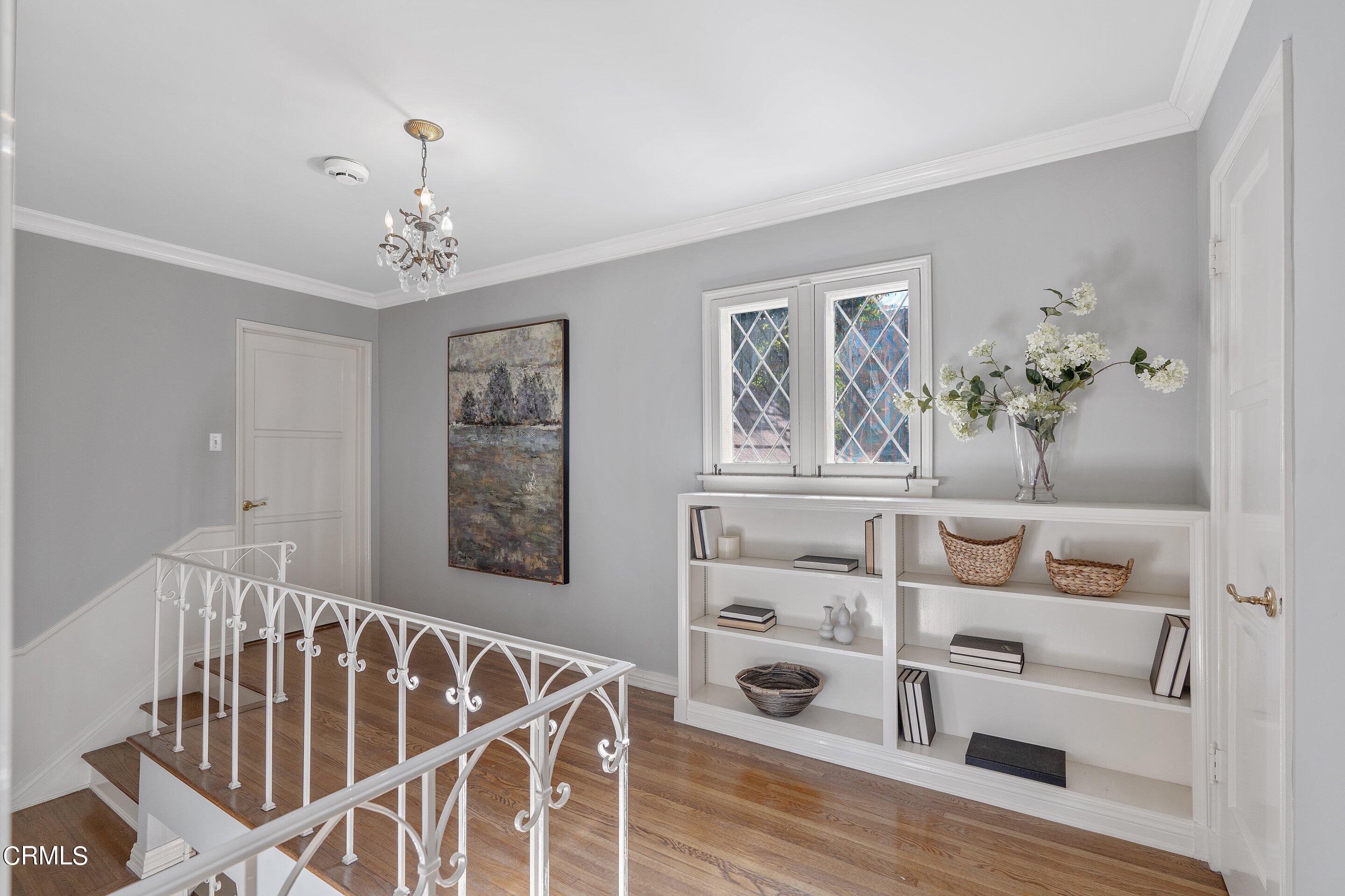 1637 Valley View Road Glendale, CA 91202 - Photo 34 of 66 a view of a dining room with furniture wooden floor and a chandelier