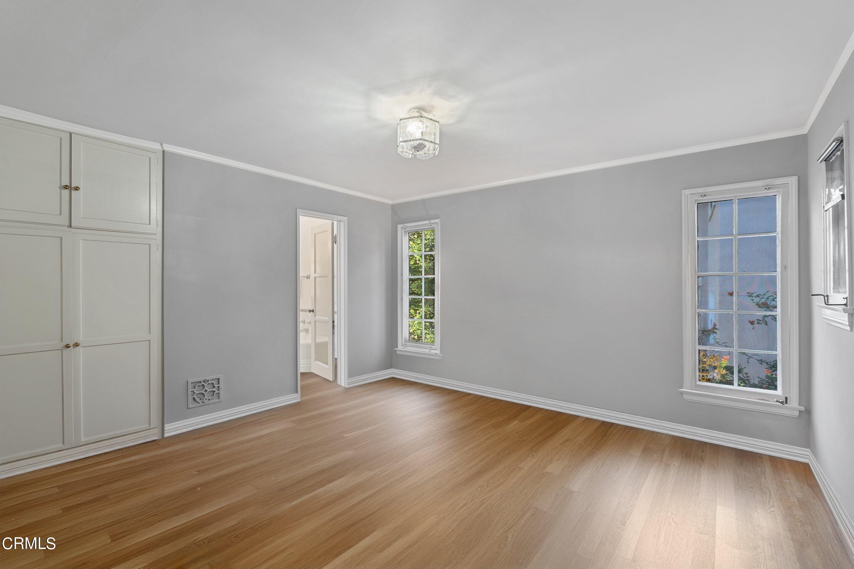 1637 Valley View Road Glendale, CA 91202 - Photo 49 of 66 a view of an empty room with wooden floor and a window
