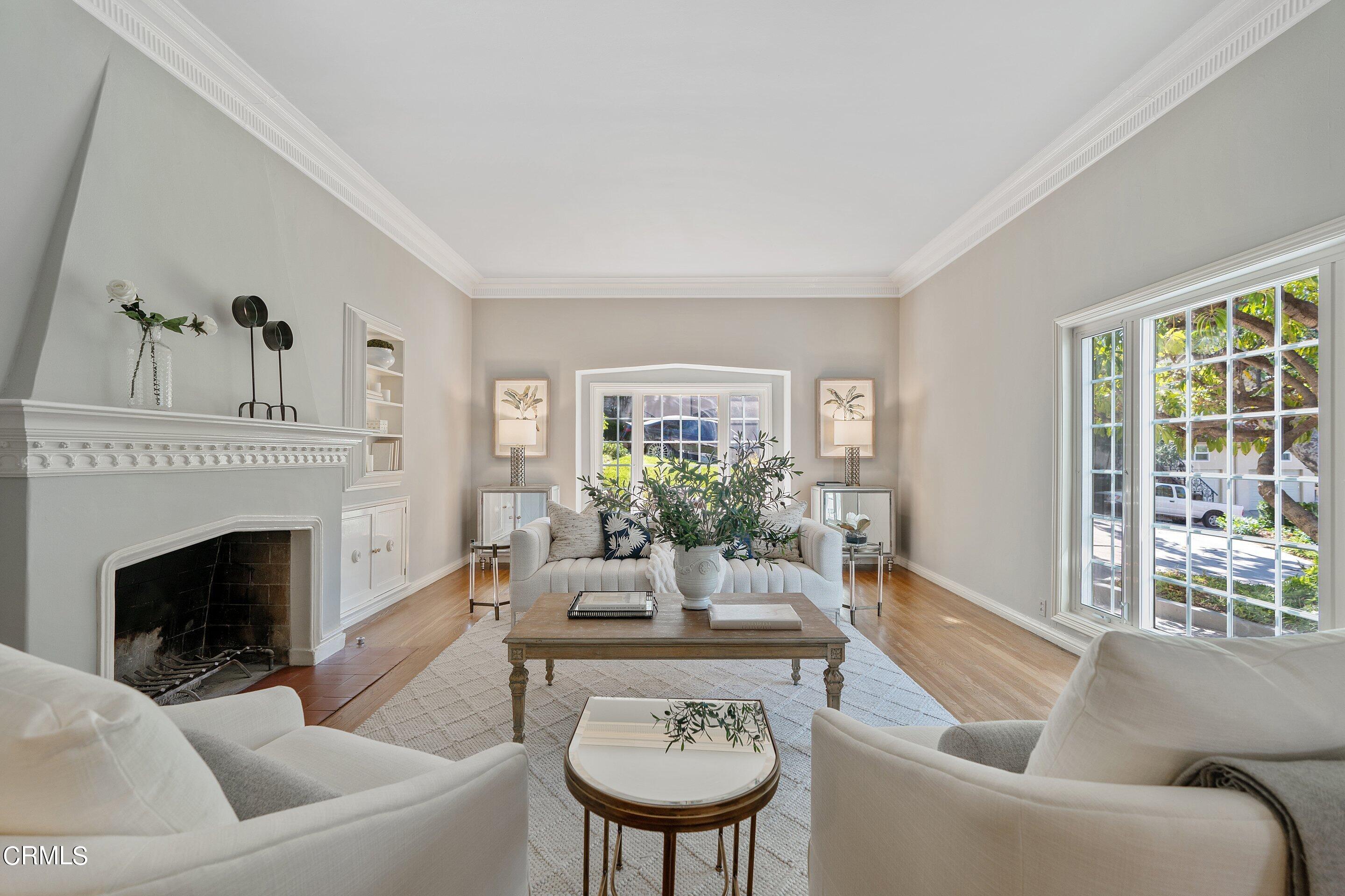 1637 Valley View Road Glendale, CA 91202 - Photo 10 of 66 a living room with furniture a fireplace and a large window