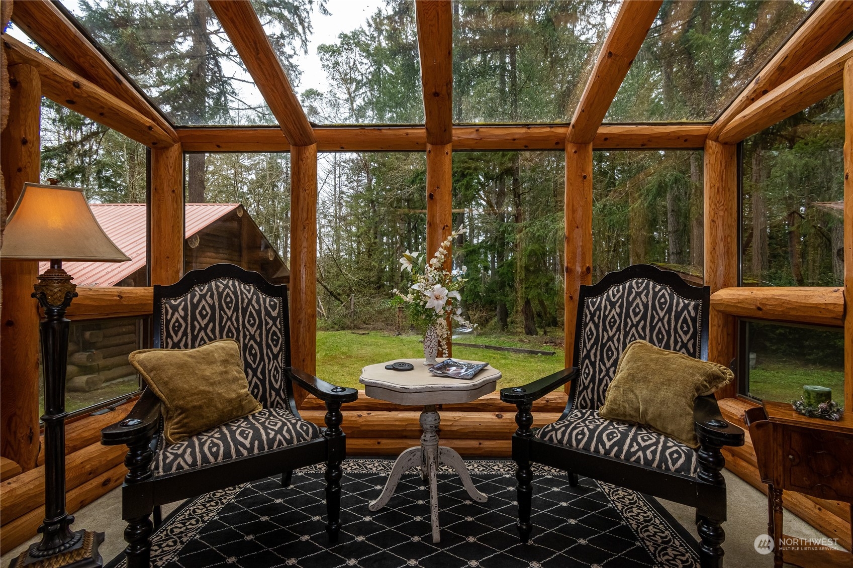 8526 Davenport Road Anderson Island, WA 98303 - Photo 13 of 31 a outdoor living space with patio furniture and a potted plant