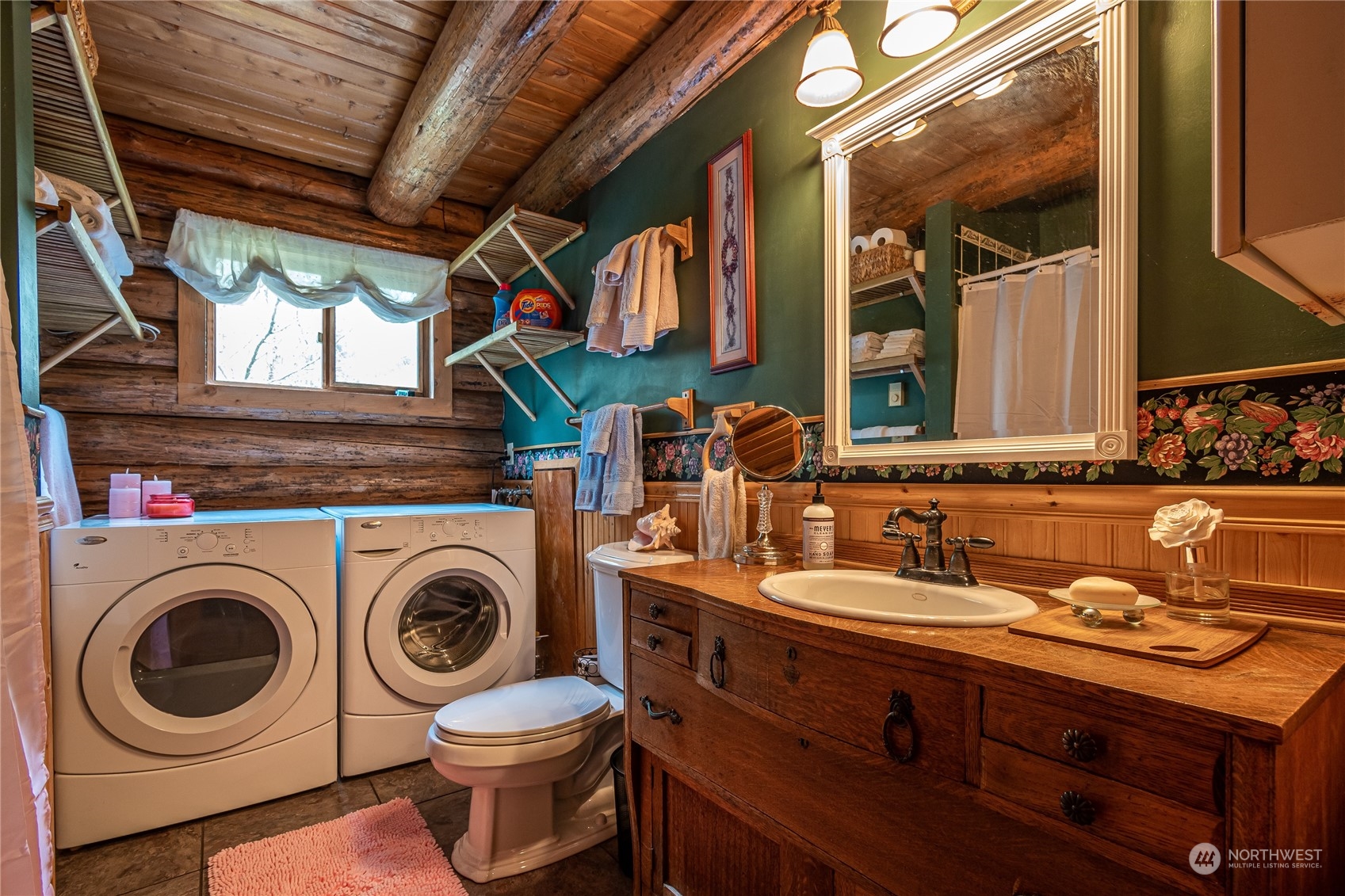 8526 Davenport Road Anderson Island, WA 98303 - Photo 18 of 31 a bathroom with a sink mirror and washer
