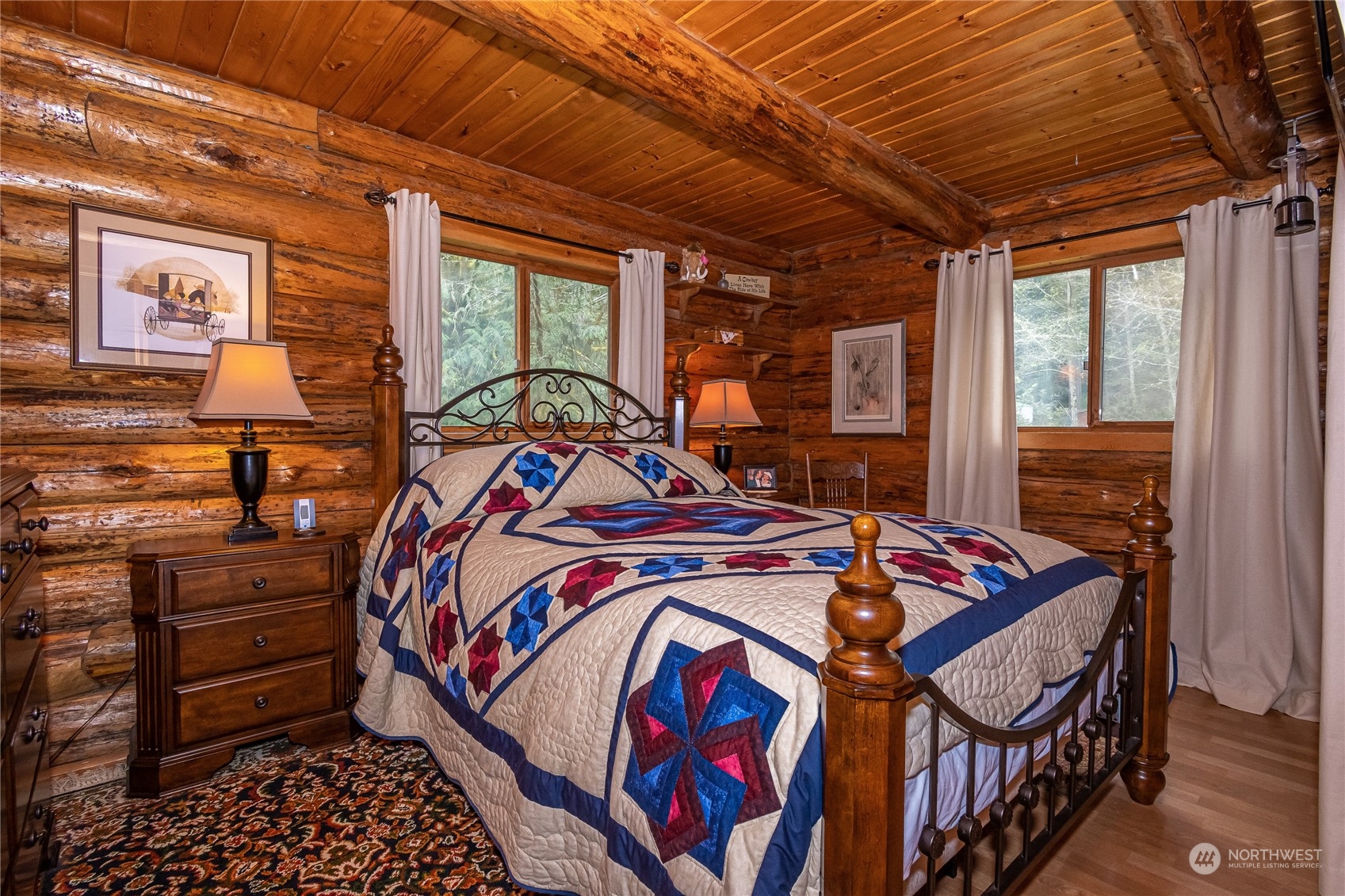 8526 Davenport Road Anderson Island, WA 98303 - Photo 19 of 31 a bed sitting in a bedroom next to a window