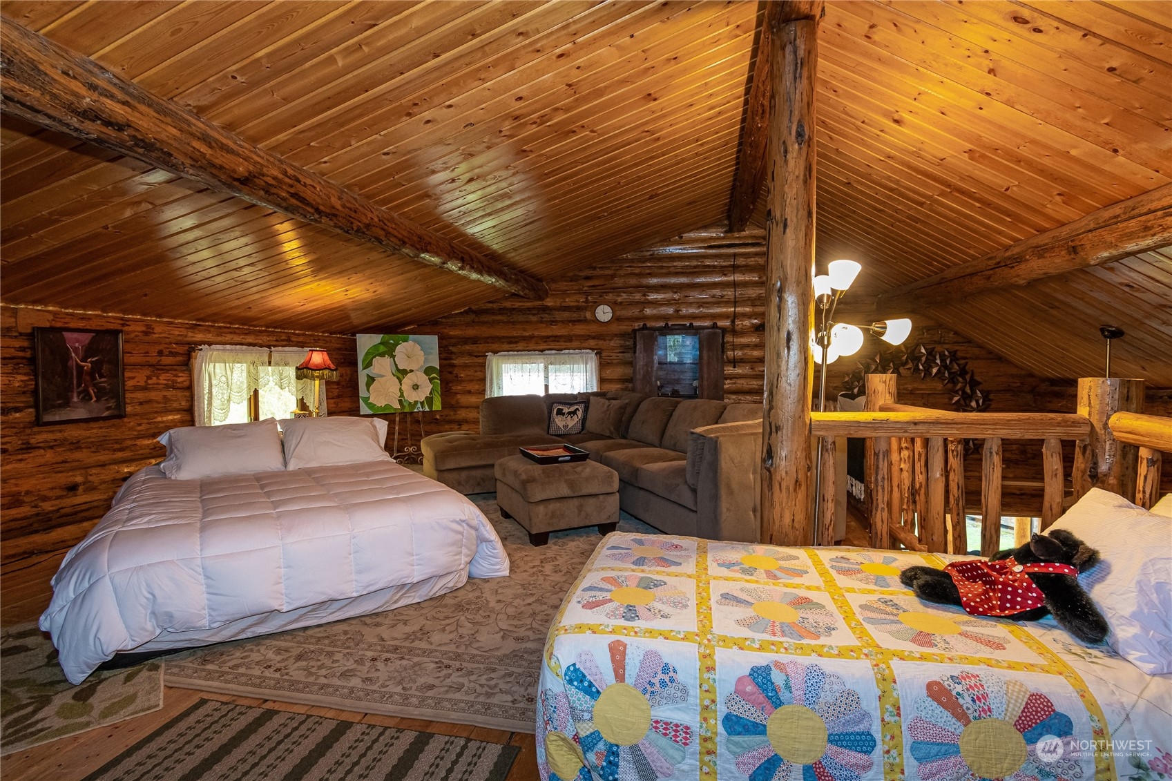 8526 Davenport Road Anderson Island, WA 98303 - Photo 21 of 31 a bedroom with bed and balcony