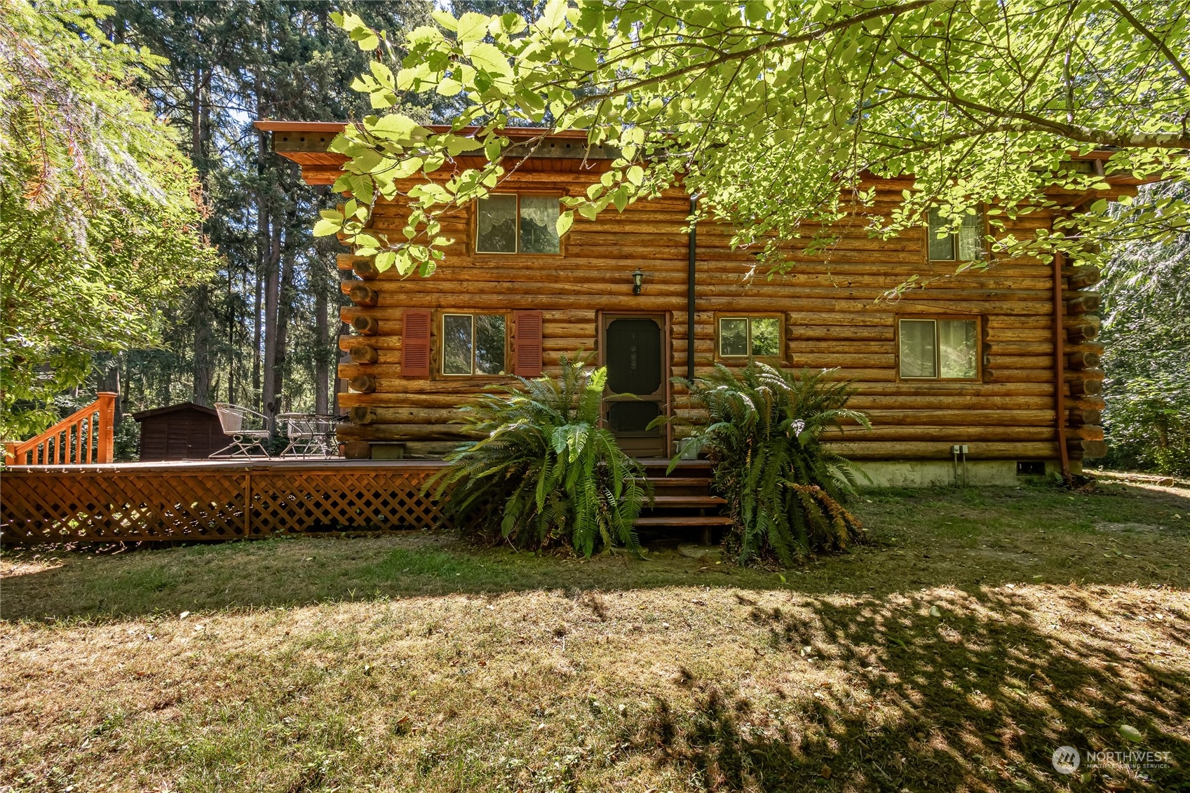 8526 Davenport Road Anderson Island, WA 98303 - Photo 25 of 31 front view of house with a yard