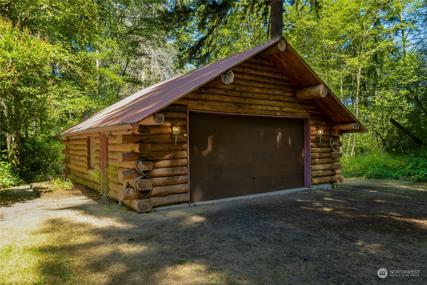 8526 Davenport Road Anderson Island, WA 98303 - Photo 26 of 31 a front view of a house with a garage