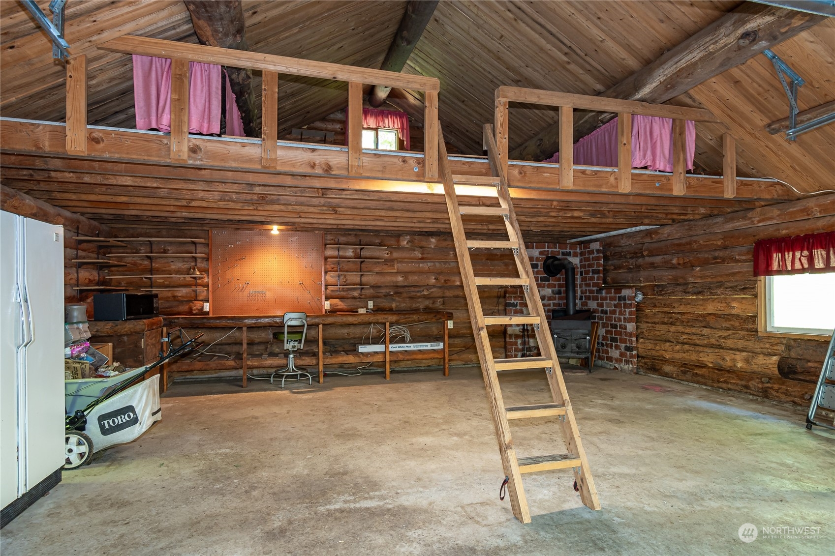 8526 Davenport Road Anderson Island, WA 98303 - Photo 27 of 31 a view of a room with racks on the wall