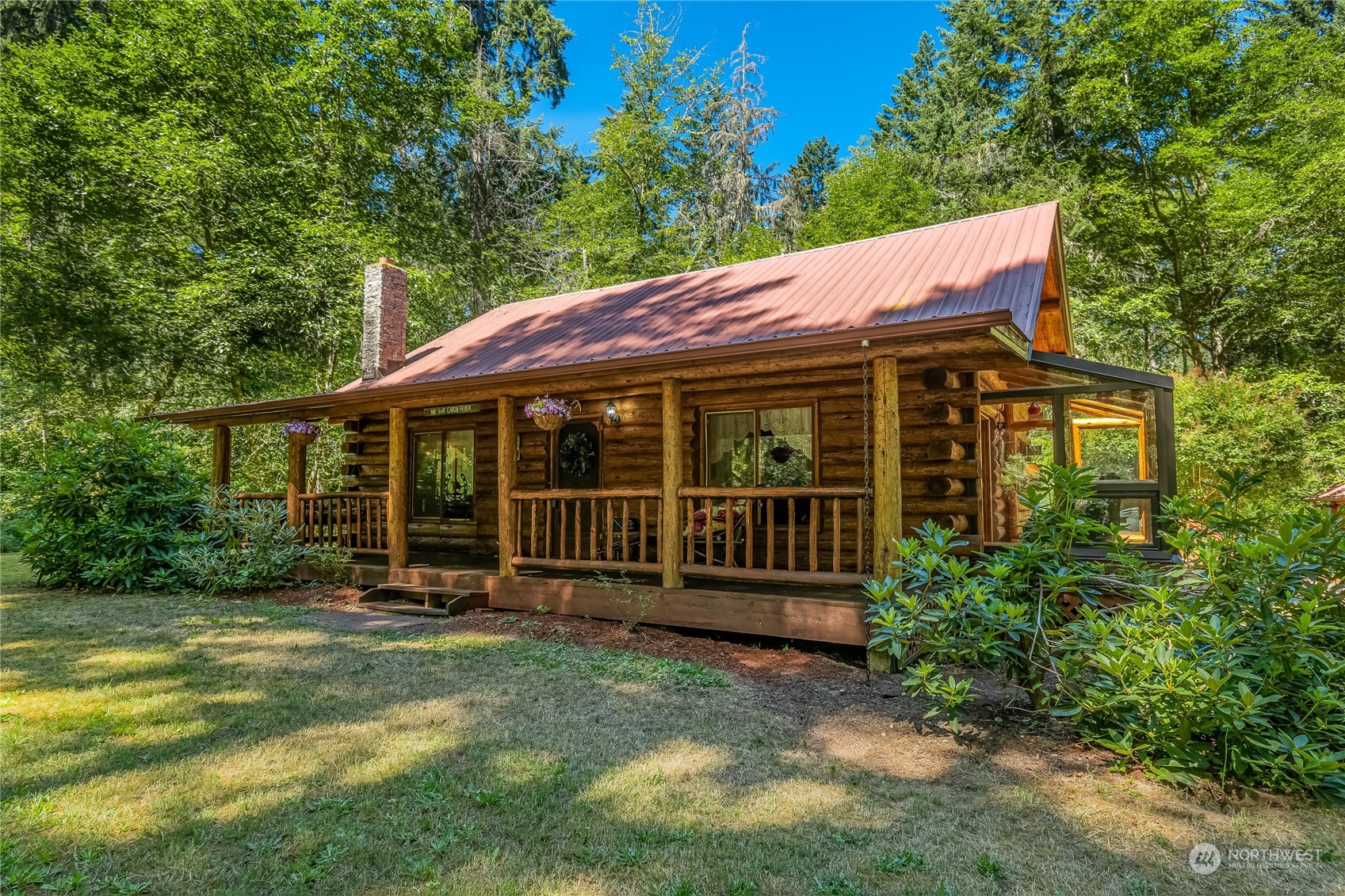 8526 Davenport Road Anderson Island, WA 98303 - Photo 3 of 31 a view of a house with a yard and sitting area