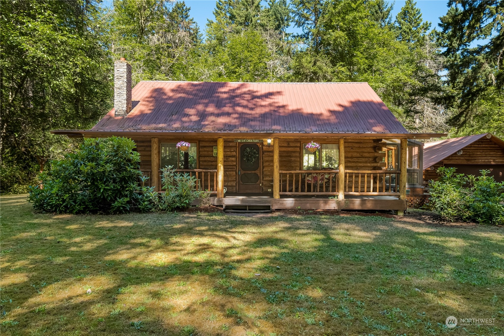 8526 Davenport Road Anderson Island, WA 98303 - Photo 31 of 31 a view of a house with a large window and a yard