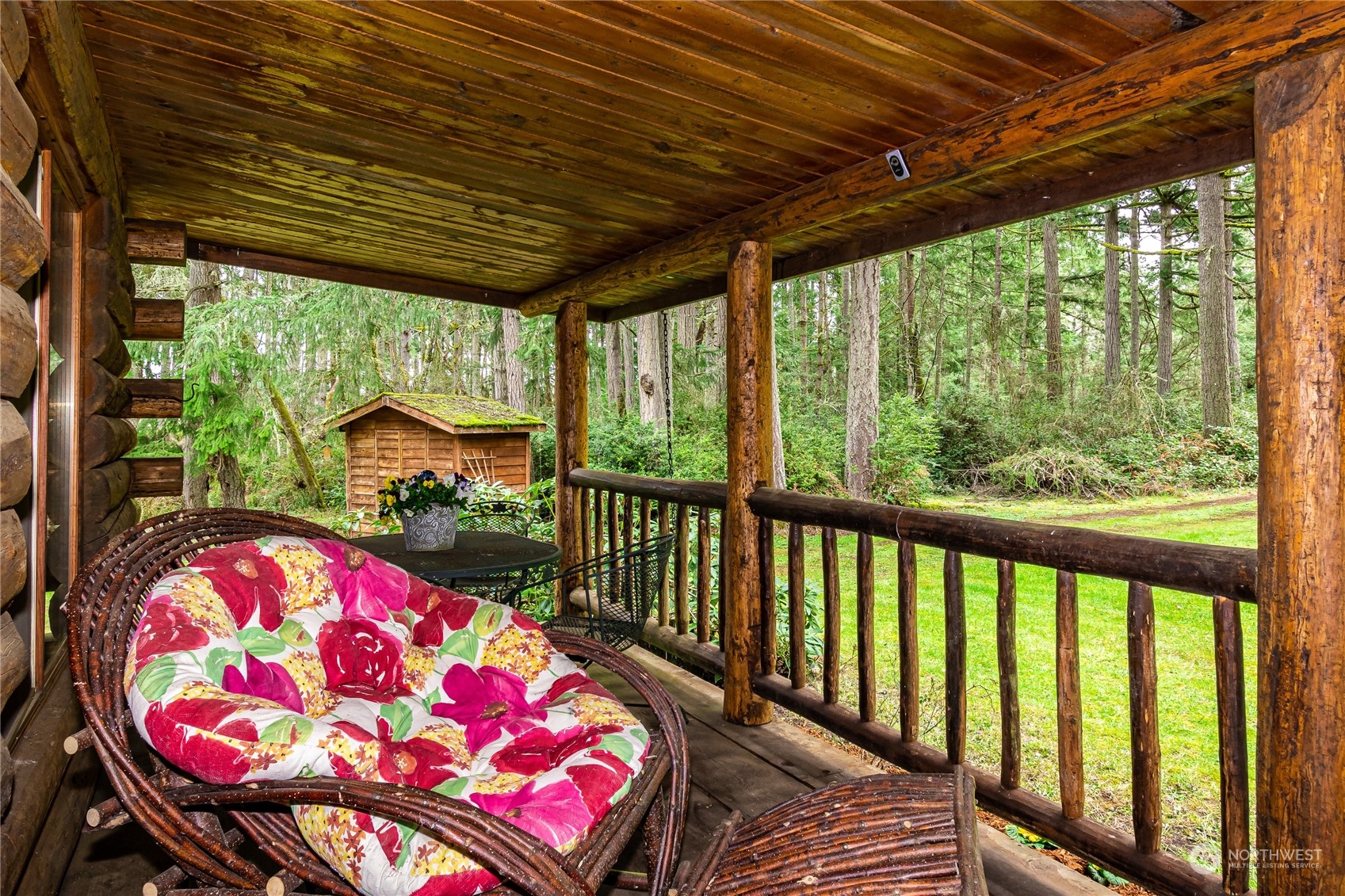 8526 Davenport Road Anderson Island, WA 98303 - Photo 8 of 31 a bedroom with furniture and large windows