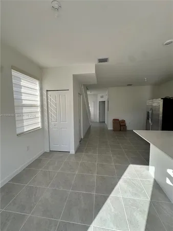 a view of kitchen with furniture and window