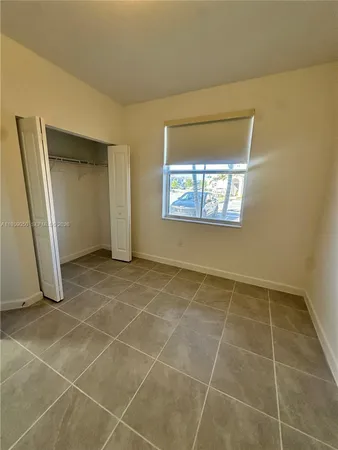 a view of an empty room with windows