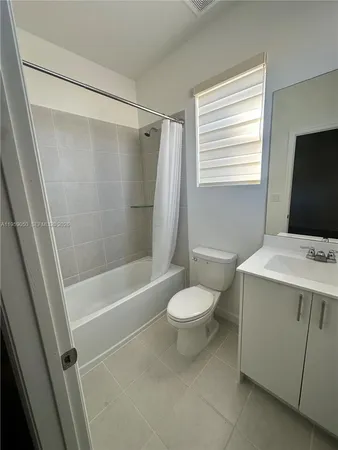a bathroom with a sink a toilet and a bathtub