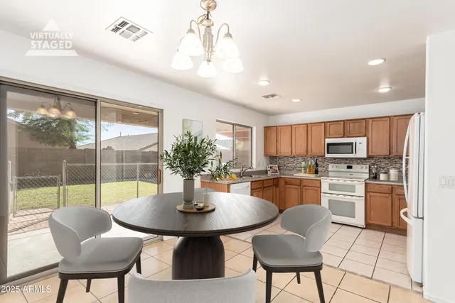 a kitchen with a sink stove and microwave