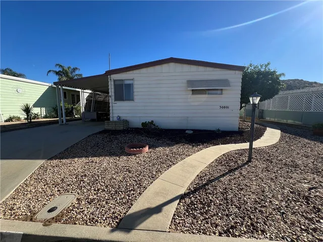 a view of a patio with table and chairs potted plants with wooden floor