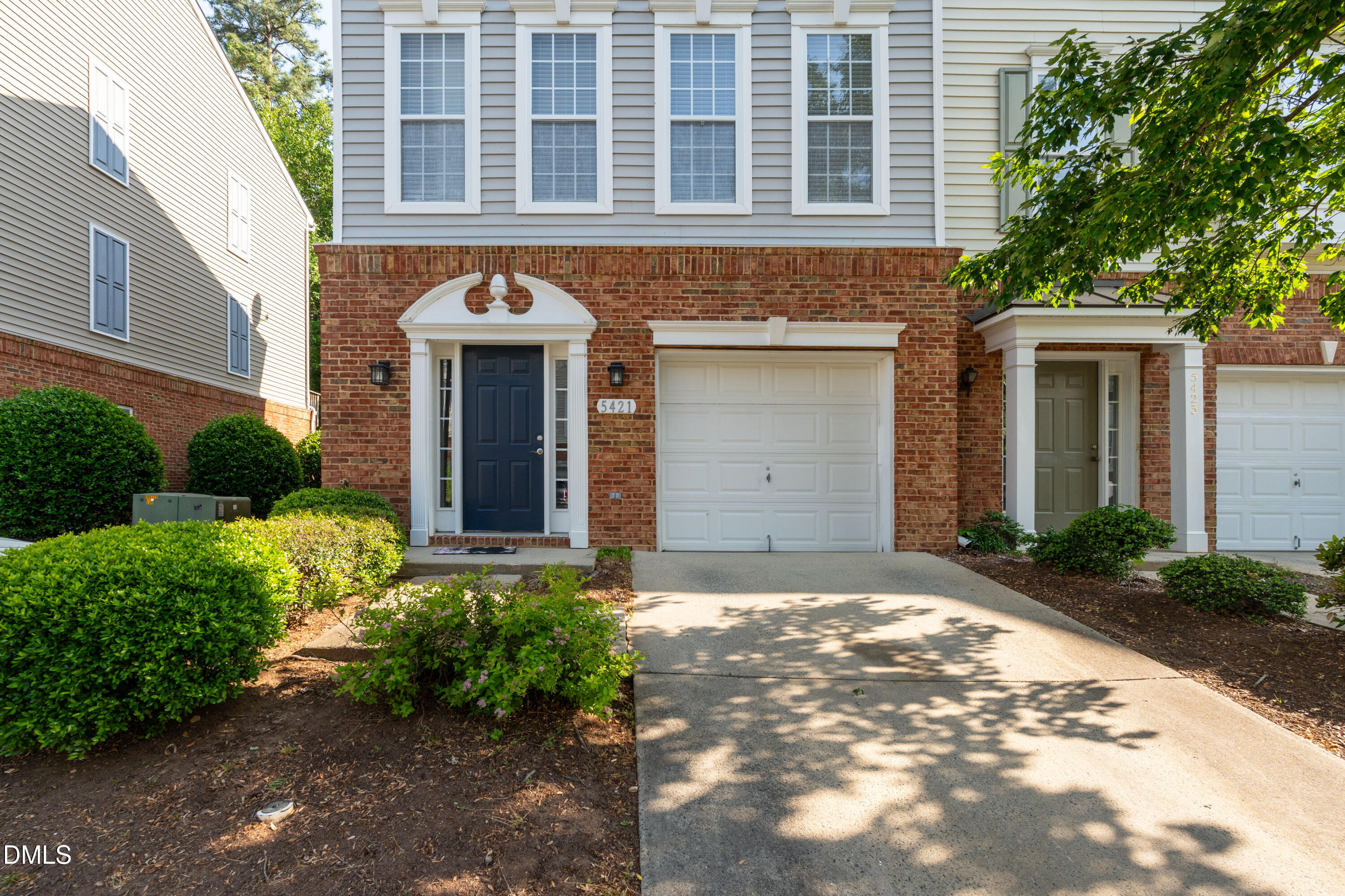 5421 Golden Arrow Lane Raleigh, NC 27613 - Photo 3 of 49 a front view of a house with garden