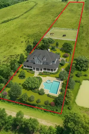 an aerial view of a house with a garden