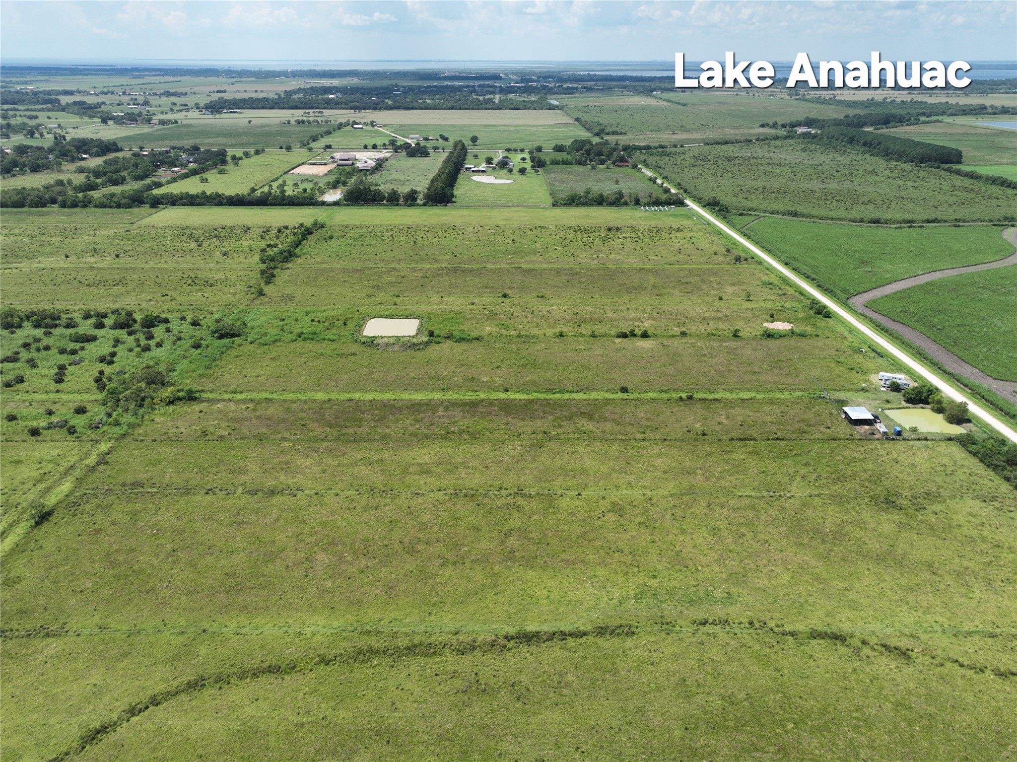 710 Heller Road Anahuac, TX 77514 - Photo 7 of 8 a view of a field with an ocean view