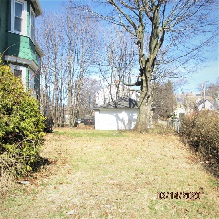 48 Nichols Street Everett, MA 02149 - Photo 14 of 18 a view of a yard with large trees