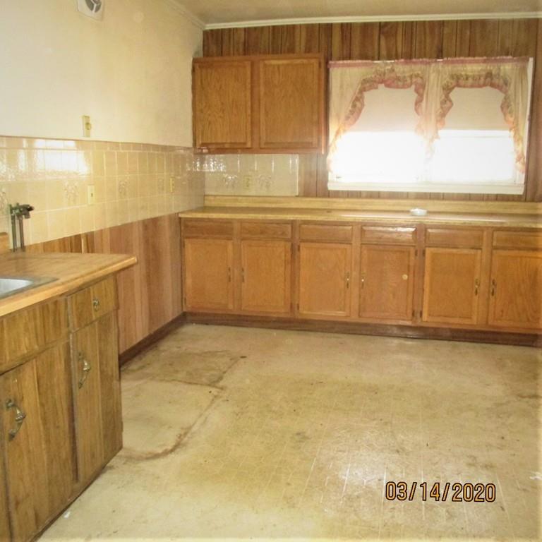 48 Nichols Street Everett, MA 02149 - Photo 2 of 18 a view of a kitchen with an empty space and a sink