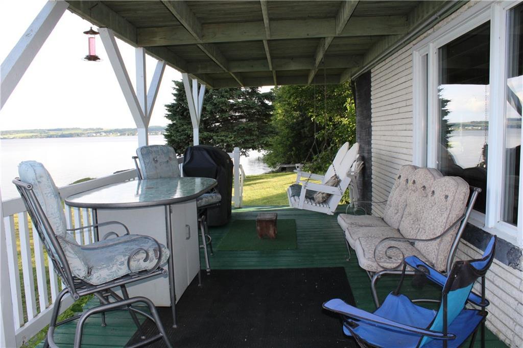 252-253 Cleveland Road St. Agatha, ME 04772 - Photo 6 of 33 Lower level Front deck facing Lake